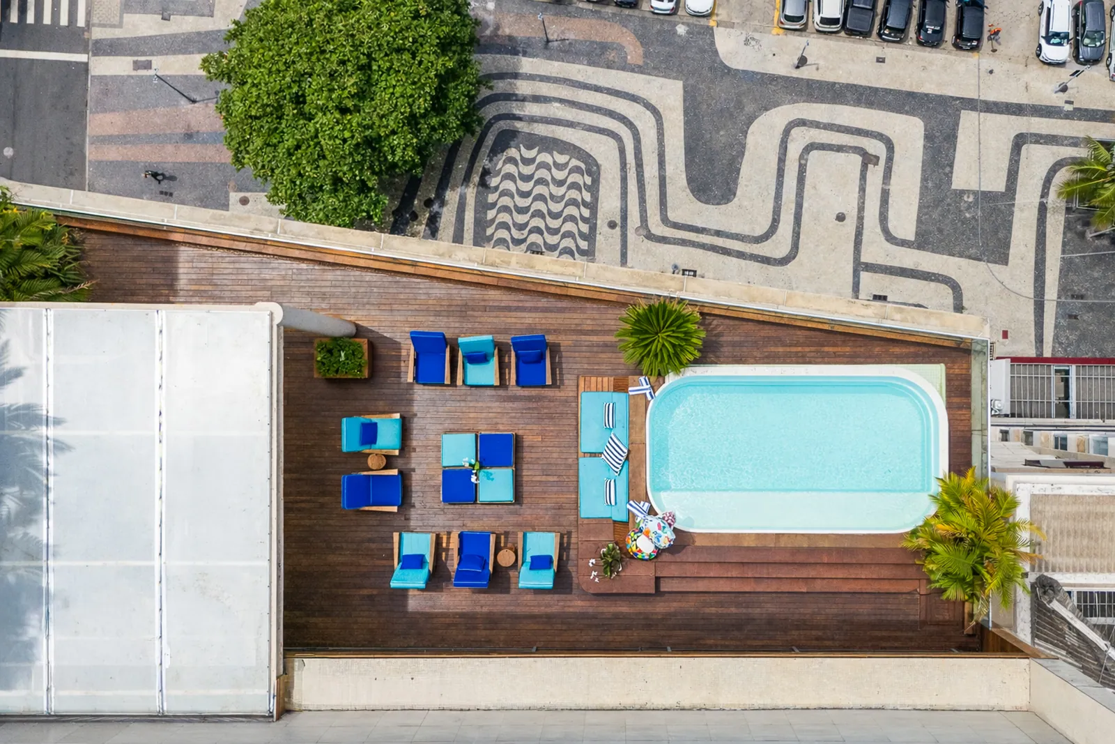 The terrace, pool and the wave-patterned promenade seen from the air