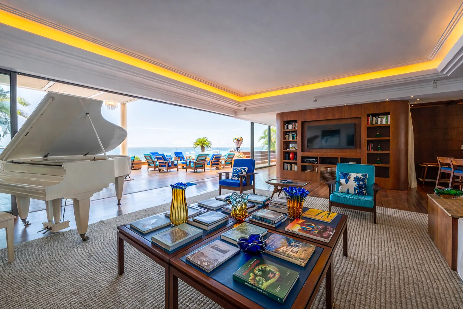 Grand piano and full-height bookshelves in the living room