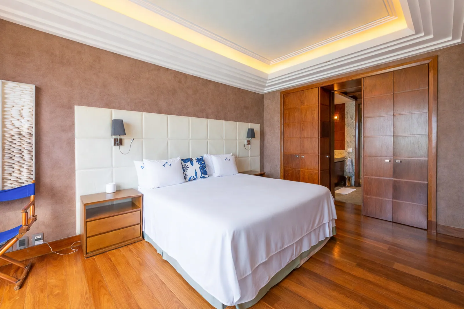 Bedroom with wood floor and fitted wardrobes