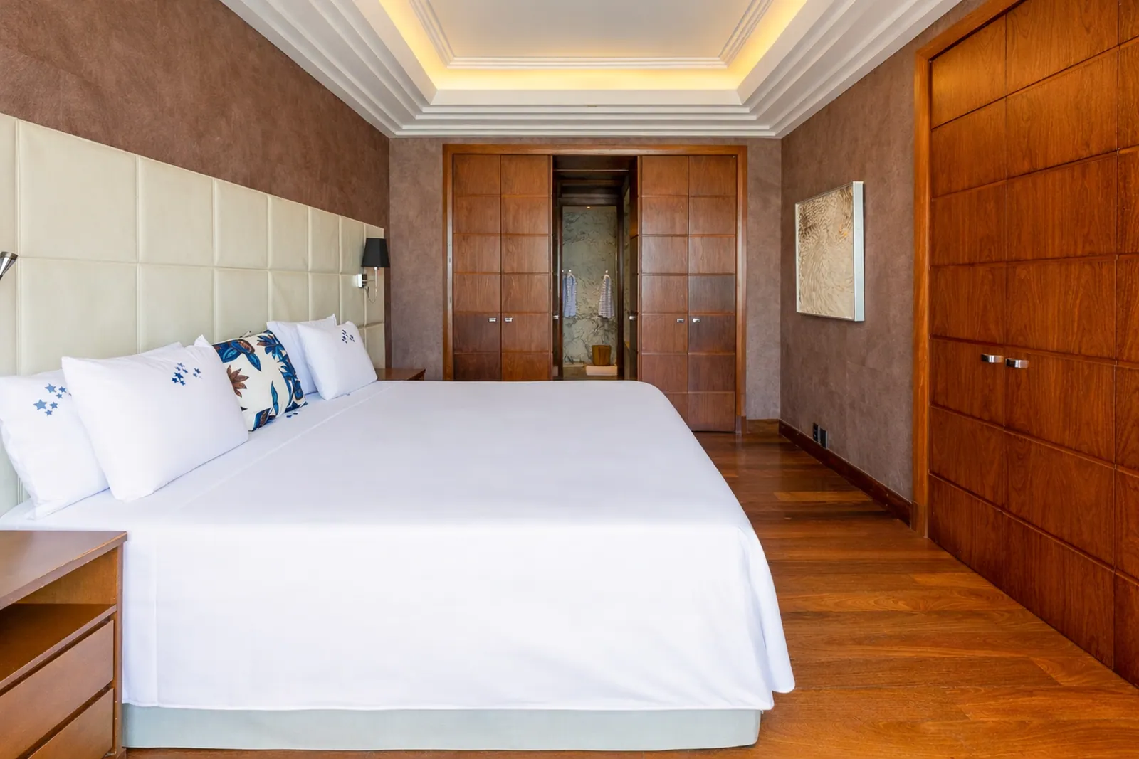 Bedroom with wardrobe running the length of the wall