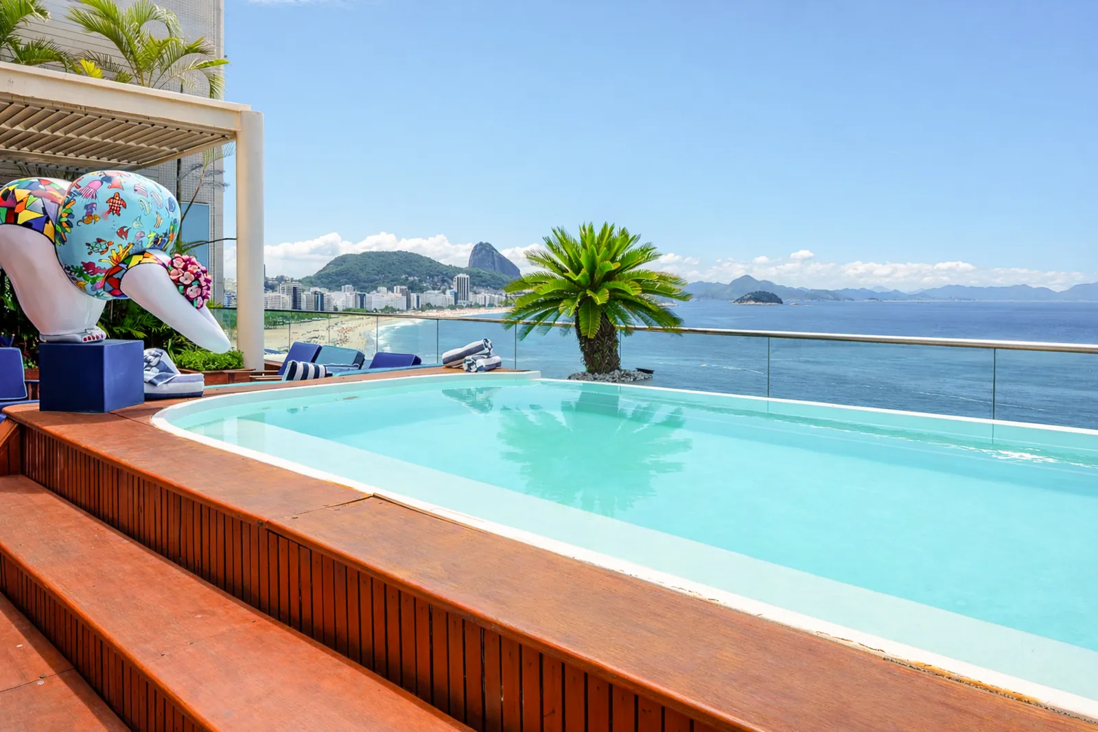 The pool on its wooden deck, Sugarloaf rising beyond