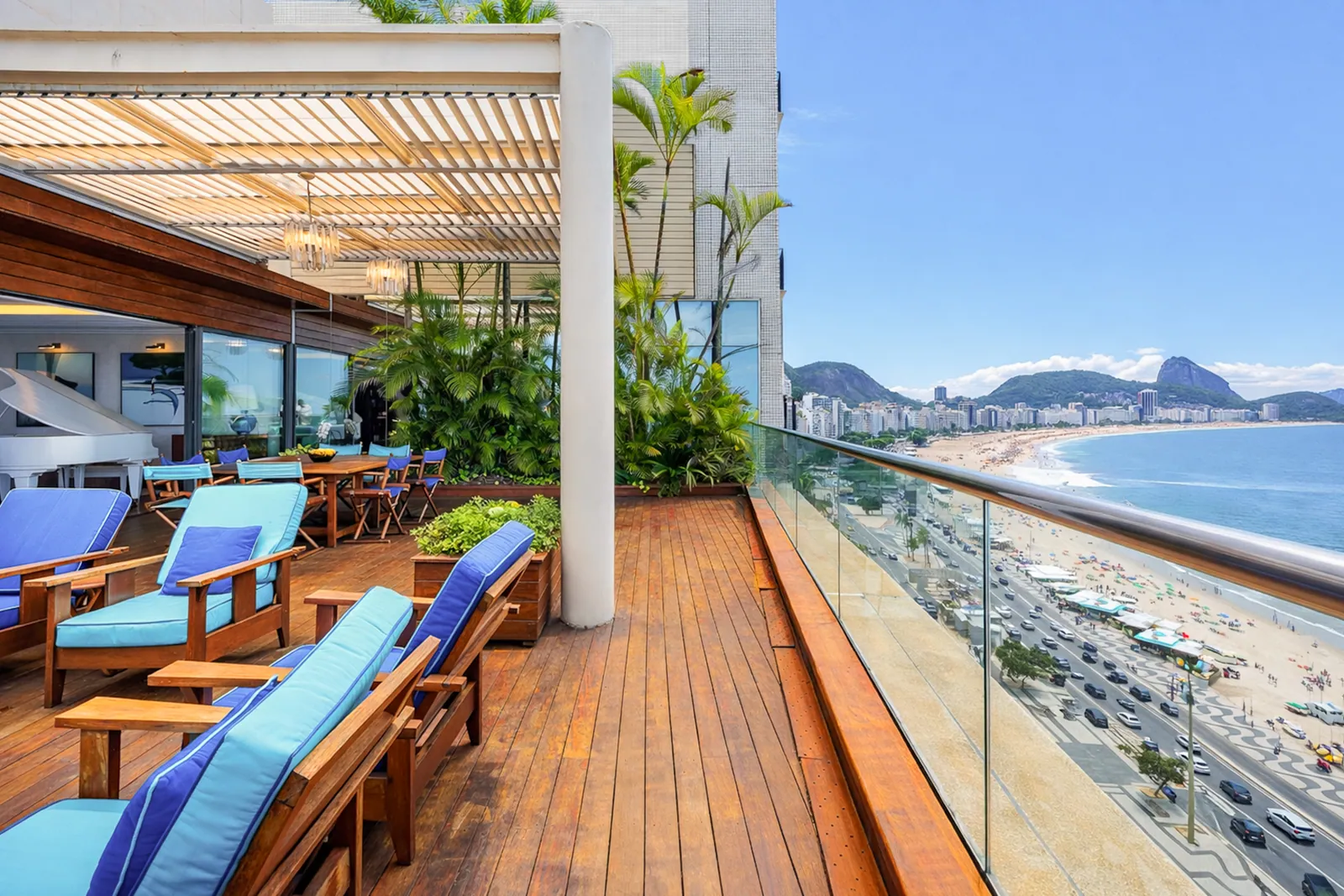 Terrace decking above the beach, glass balustrade at the edge