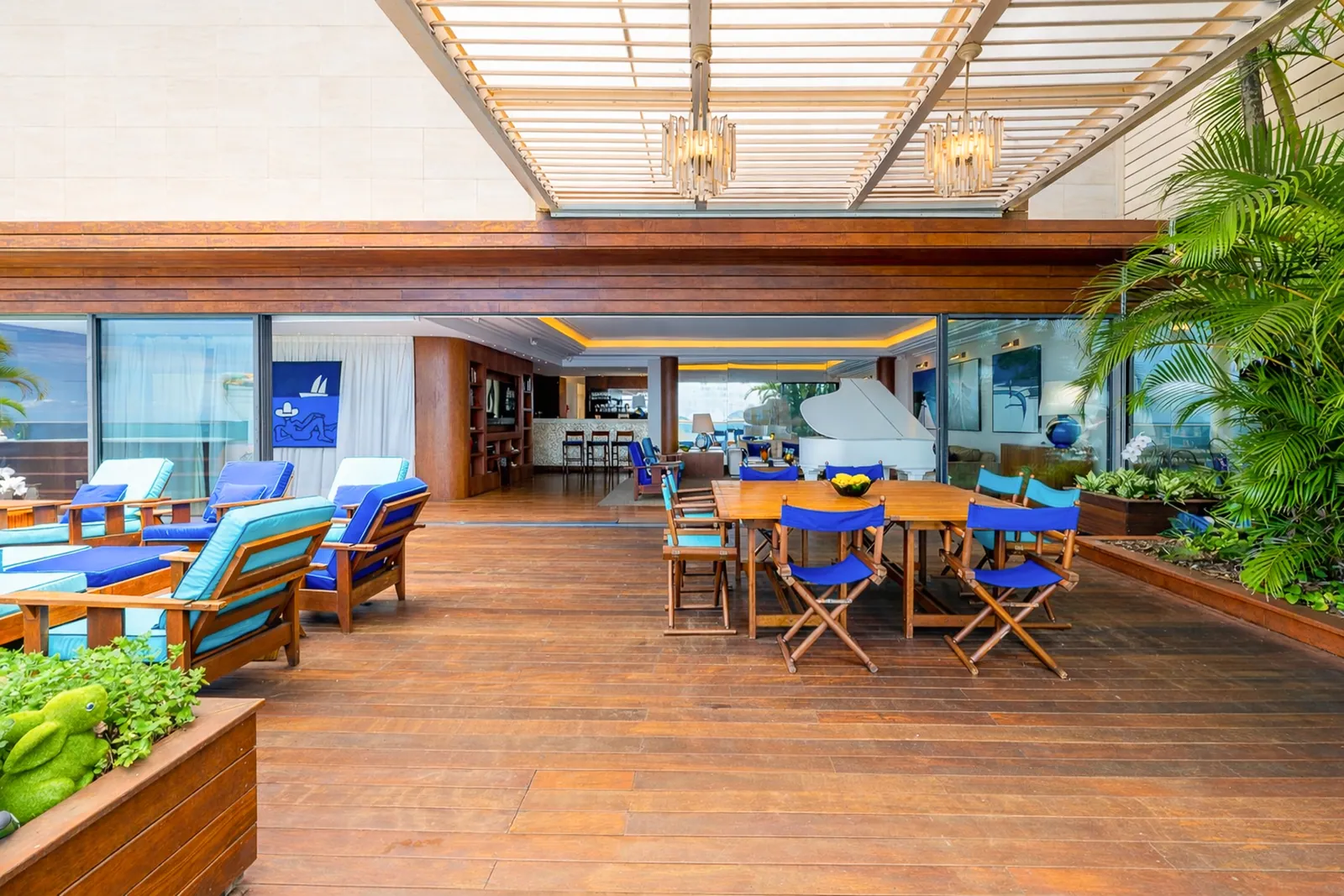 Dining area on the terrace, the living room opening behind